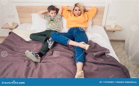 mom and son sharing the bed